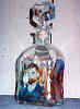 I have enjoyed painting for about thirty years - I find it relaxing - glass painting is a new medium to me. I have painted four copies of Van Gogh's paintings on the decanter. 
They are 1) Self portrait, 2) Place du Forum, 3) Sunflowers, 4) Church a