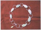 Nature's contours has been my inspiration for some little while and this leaf circle necklace met that brief. It is hand made in silver sheet tube and wire. From design to completion it has allowed me to develop many skills such as deep breathing and