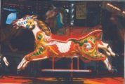 Photograph was taken at the Weeting Steam Rally. This Carousel (Gallopers) has been in the Downs family for years.