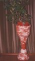 This is an experimentation with marbled coiling as a pose to marbling and thrown clay. The two different coloured clays were rolled out, then plaited and coiled. Is this design innovative as I have not read about it before?